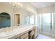 Bathroom with double sinks, vanity, and shower at 11806 N 40Th Pl, Phoenix, AZ 85028