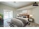 Virtually staged main bedroom with sliding door to patio at 11806 N 40Th Pl, Phoenix, AZ 85028
