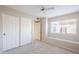 Bedroom with window seat, closet and ceiling fan at 11806 N 40Th Pl, Phoenix, AZ 85028