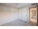 Bright bedroom with carpet flooring and double door closet at 11806 N 40Th Pl, Phoenix, AZ 85028