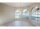 Bright dining area with large windows, chandelier, and tile floor at 11806 N 40Th Pl, Phoenix, AZ 85028