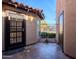 Private entryway with tiled flooring and wrought iron door at 11806 N 40Th Pl, Phoenix, AZ 85028