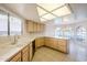 Eat-in kitchen with an island, wood cabinets, and tile flooring at 11806 N 40Th Pl, Phoenix, AZ 85028
