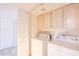 Laundry room with washer, dryer, and upper cabinets at 11806 N 40Th Pl, Phoenix, AZ 85028
