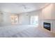 Spacious living room features a fireplace and sliding glass doors leading to a patio at 11806 N 40Th Pl, Phoenix, AZ 85028