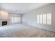 Spacious living room with fireplace and large windows at 11806 N 40Th Pl, Phoenix, AZ 85028