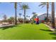 Artificial turf backyard with inflatable bounce house at 1372 W Crane Dr, Chandler, AZ 85286