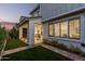 Landscaped backyard with patio and artificial turf at 1372 W Crane Dr, Chandler, AZ 85286
