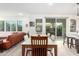 Bright dining area with wooden table and access to backyard at 1372 W Crane Dr, Chandler, AZ 85286