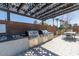 Two built-in stainless steel grills under pergola at 1372 W Crane Dr, Chandler, AZ 85286