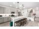 Modern kitchen with gray cabinets, quartz countertops, and an island at 1372 W Crane Dr, Chandler, AZ 85286