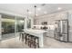 Modern kitchen with gray cabinets, island, and stainless steel appliances at 1372 W Crane Dr, Chandler, AZ 85286