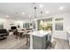 Open concept kitchen with island, stainless steel appliances, and breakfast bar at 1372 W Crane Dr, Chandler, AZ 85286