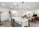Modern kitchen with white quartz island and farm sink at 1372 W Crane Dr, Chandler, AZ 85286