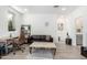Home office with leather chair and modern coffee table at 1372 W Crane Dr, Chandler, AZ 85286