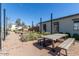 Outdoor picnic tables and benches under string lights at 1372 W Crane Dr, Chandler, AZ 85286