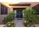 Inviting front entry with a decorative door and landscaping at 13931 E Peak View Rd, Scottsdale, AZ 85262