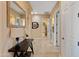 Elegant hallway with a view of a bathroom and a mirror at 13931 E Peak View Rd, Scottsdale, AZ 85262