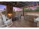 Outdoor entertainment area with fireplace and bar at 13931 E Peak View Rd, Scottsdale, AZ 85262