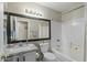 Bathroom with single vanity, bathtub, and updated flooring at 1633 E Lakeside Dr # 113, Gilbert, AZ 85234
