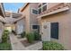 Shared walkway leading to condo unit entrances with landscaping at 1633 E Lakeside Dr # 113, Gilbert, AZ 85234