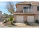 Two-story building with attached garages, landscaping and a walkway at 1633 E Lakeside Dr # 113, Gilbert, AZ 85234