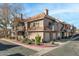 Two-story building with Spanish-style tile roofing, balconies, and landscaping at 1633 E Lakeside Dr # 113, Gilbert, AZ 85234