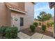 Front door entrance to a condo unit with landscaping at 1633 E Lakeside Dr # 113, Gilbert, AZ 85234