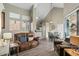 Open concept living and dining area with vaulted ceilings, wood-look floors and a view to the kitchen at 1633 E Lakeside Dr # 113, Gilbert, AZ 85234