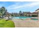 Community pool with lounge chairs and spa at 1633 E Lakeside Dr # 113, Gilbert, AZ 85234