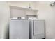 Laundry room with washer, dryer, and shelving at 17775 N Lainie Ct, Surprise, AZ 85374