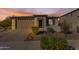 Single-story home with landscaped front yard, two-car garage, and neutral color palette at 20190 N Wilford Ave, Maricopa, AZ 85138