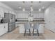 Modern kitchen island with granite countertop and stainless steel appliances at 20190 N Wilford Ave, Maricopa, AZ 85138