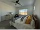 Serene bedroom with a king bed, dresser, and a window with backyard view at 2507 N Casa Grande Ave, Casa Grande, AZ 85122