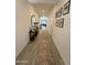 Long entry hallway with wood-look floors and a runner rug at 2507 N Casa Grande Ave, Casa Grande, AZ 85122