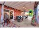 Relaxing covered patio with seating area, string lights, and potted plants at 3044 W Desert Cove Ave, Phoenix, AZ 85029