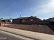 Brick ranch home with attached garage and landscaped yard at 4643 W Laurel Ln, Glendale, AZ 85304
