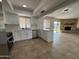 Open concept kitchen with island and view into living room at 4643 W Laurel Ln, Glendale, AZ 85304