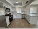 Renovated kitchen, features white cabinets, stainless steel appliances, and quartz countertops at 4643 W Laurel Ln, Glendale, AZ 85304