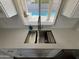 Modern farmhouse sink with a stainless steel grid at 4643 W Laurel Ln, Glendale, AZ 85304