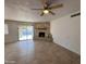 Spacious living room, fireplace, and view of the pool at 4643 W Laurel Ln, Glendale, AZ 85304