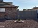 Landscaped side yard with brick fire pit and gate at 4643 W Laurel Ln, Glendale, AZ 85304