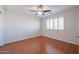 Bright bedroom with wood floors and ceiling fan at 5124 W Gwen St, Laveen, AZ 85339