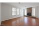 Living room with hardwood floors and a stone fireplace at 5124 W Gwen St, Laveen, AZ 85339