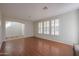 Living room with hardwood floors and plantation shutters at 5124 W Gwen St, Laveen, AZ 85339