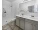 Bathroom with double sinks, shower, and tile floors at 521 E Cheyenne Rd, San Tan Valley, AZ 85143
