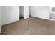 Well-lit bedroom with walk-in closet and carpet at 521 E Cheyenne Rd, San Tan Valley, AZ 85143