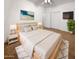 Bright bedroom with light wood platform bed and large closet at 521 E Cheyenne Rd, San Tan Valley, AZ 85143