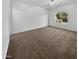 Spacious bedroom with large window and ceiling fan at 521 E Cheyenne Rd, San Tan Valley, AZ 85143