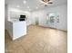 Kitchen with island, white cabinets, and access to backyard at 521 E Cheyenne Rd, San Tan Valley, AZ 85143